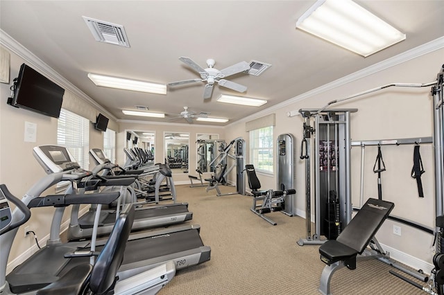 exercise room featuring ceiling fan, light carpet, and ornamental molding