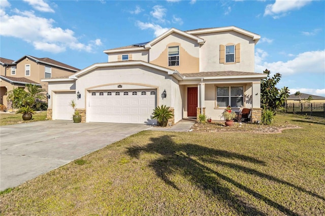 view of front of house with a garage and a front lawn