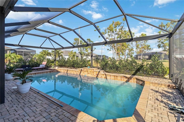 view of pool featuring a patio area and a lanai