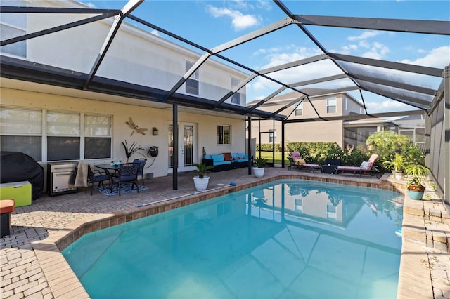 view of pool featuring a lanai and a patio area