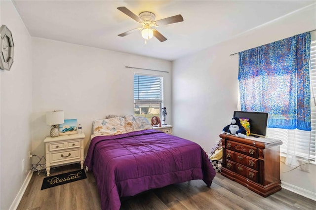 bedroom featuring hardwood / wood-style flooring and ceiling fan