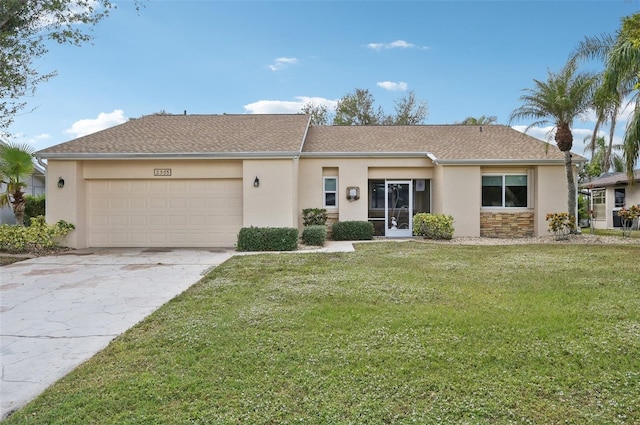 single story home with a garage and a front yard