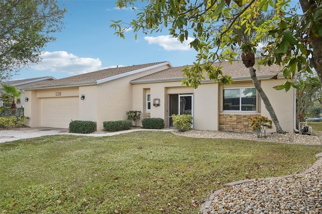 single story home featuring a front yard and a garage