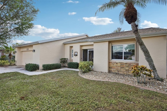 view of front of house with a front lawn and a garage