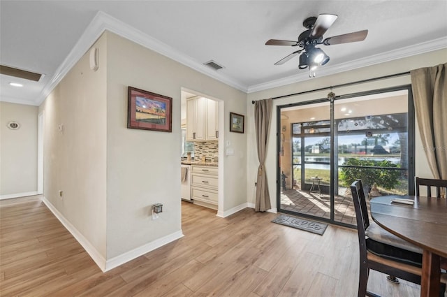 dining area with ceiling fan, light hardwood / wood-style flooring, and ornamental molding