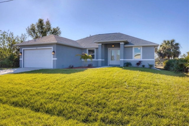 view of front of house with a garage and a front yard