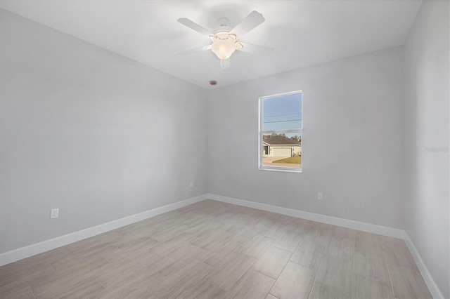 spare room with ceiling fan