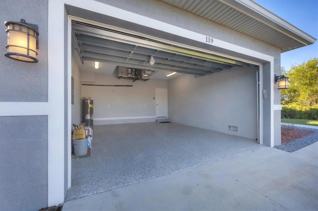 garage featuring a garage door opener and gas water heater