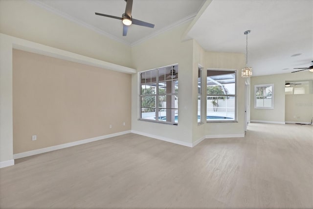 unfurnished living room featuring a notable chandelier, light hardwood / wood-style floors, and crown molding