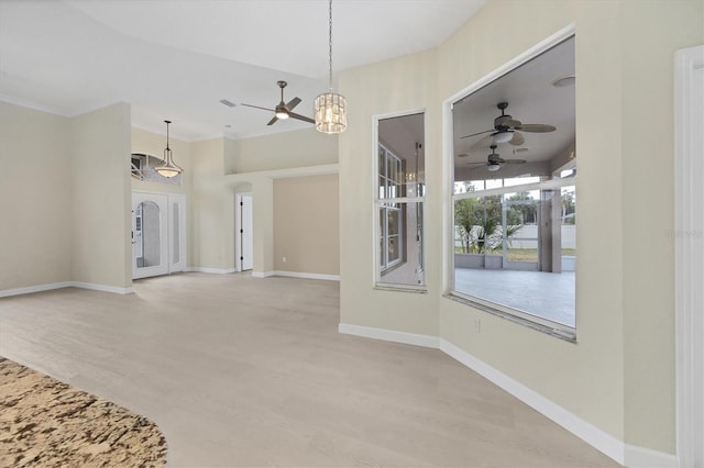 interior space with light hardwood / wood-style floors, crown molding, and a chandelier