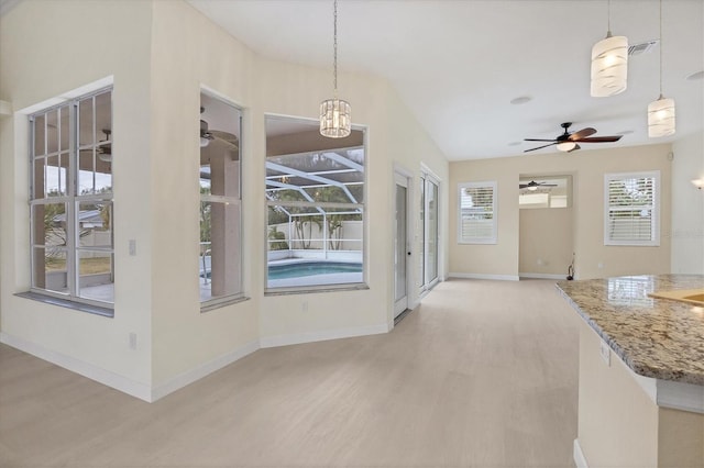 unfurnished dining area featuring ceiling fan and light hardwood / wood-style flooring