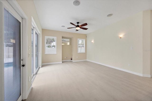 unfurnished room featuring light hardwood / wood-style flooring and ceiling fan