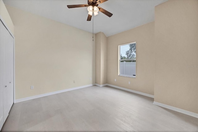 spare room featuring light hardwood / wood-style flooring and ceiling fan