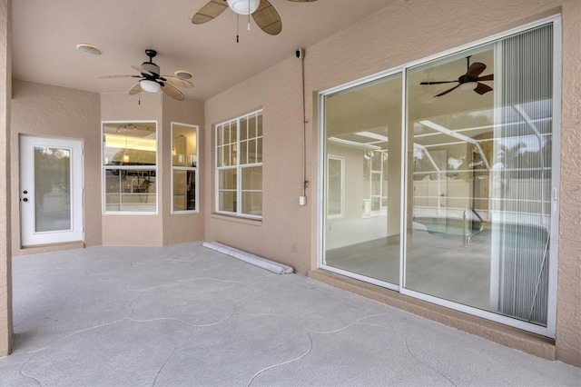 view of patio featuring ceiling fan