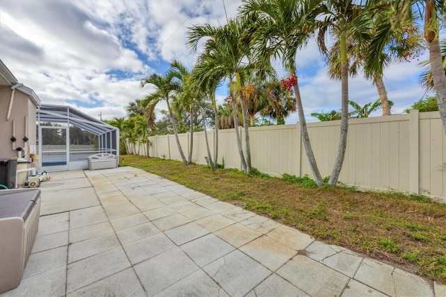 view of patio / terrace featuring a lanai