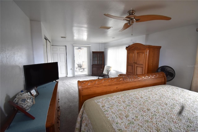 carpeted bedroom with a closet and ceiling fan