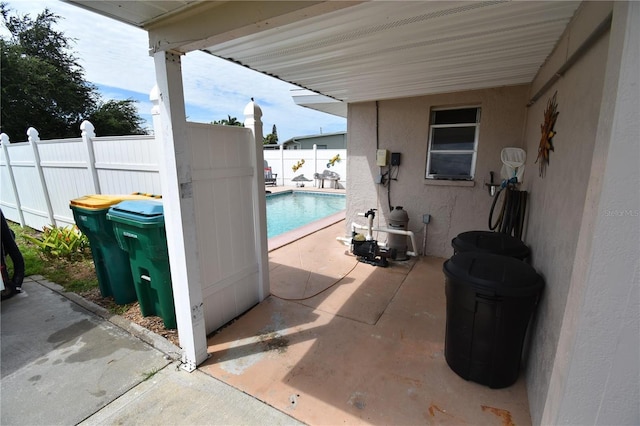 view of patio / terrace with a fenced in pool