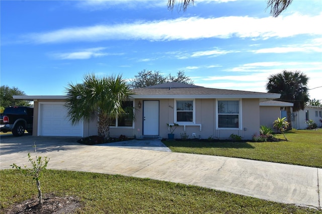 ranch-style home with a garage and a front lawn