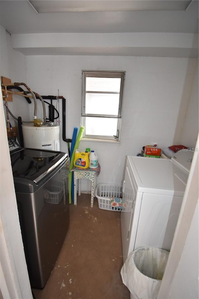 laundry room with electric water heater and independent washer and dryer