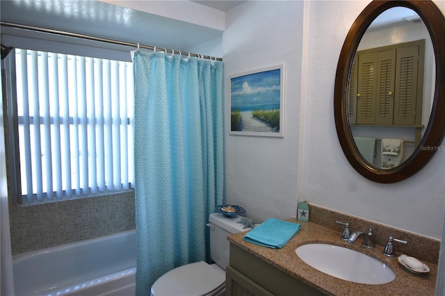 full bathroom featuring shower / bathtub combination with curtain, vanity, and toilet