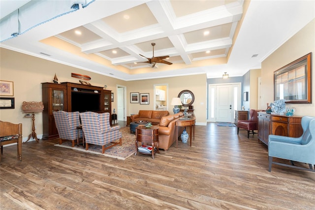 living room with beam ceiling, ceiling fan, dark wood-type flooring, coffered ceiling, and crown molding