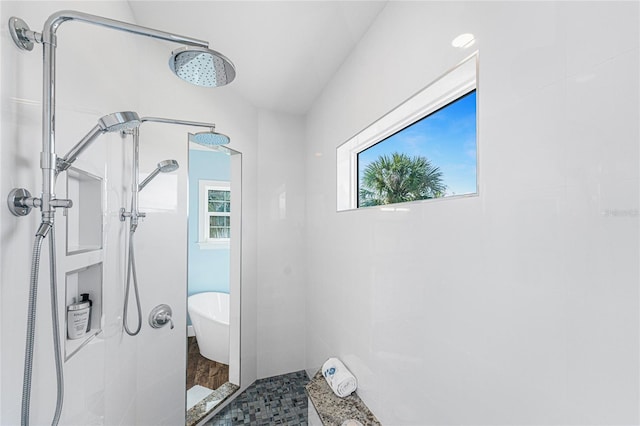 bathroom featuring separate shower and tub