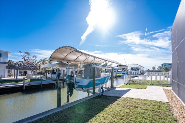 dock area featuring a yard and a water view