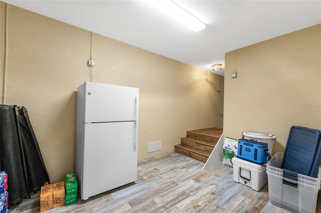 kitchen featuring white fridge and light wood-type flooring