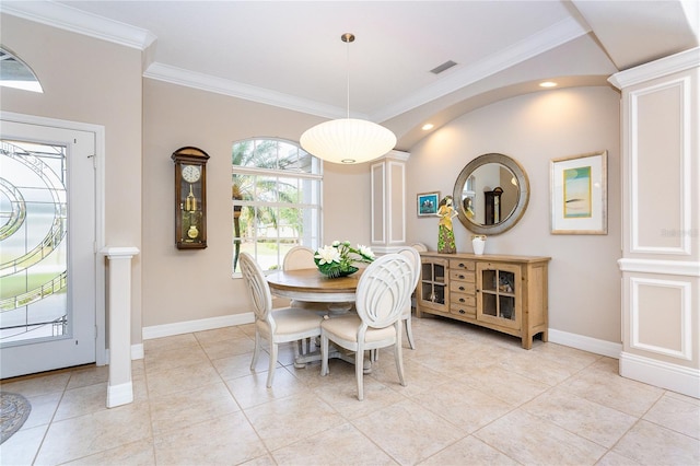 dining room with light tile patterned floors and ornamental molding