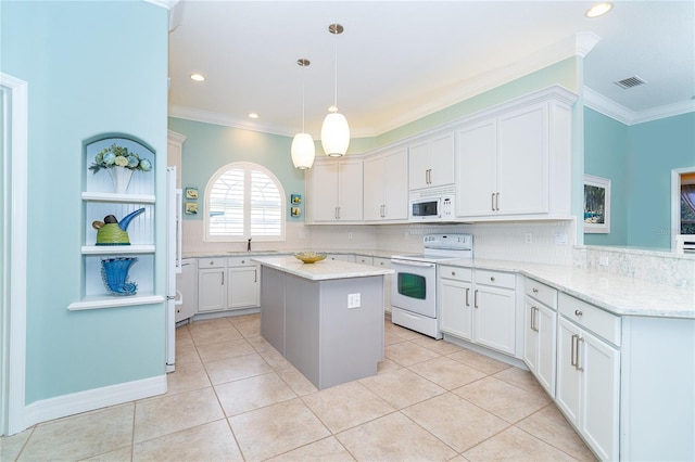 kitchen with a center island, white cabinets, pendant lighting, and white appliances