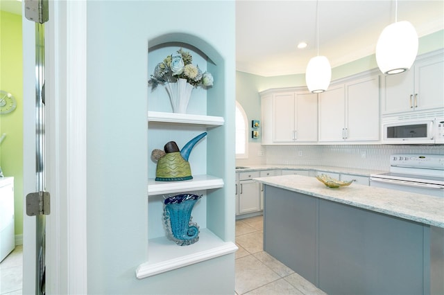 kitchen featuring white cabinets, range with electric cooktop, hanging light fixtures, and tasteful backsplash