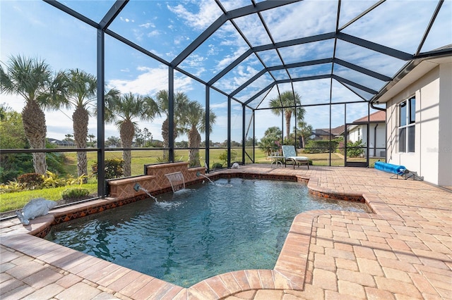 view of swimming pool featuring glass enclosure, pool water feature, and a patio