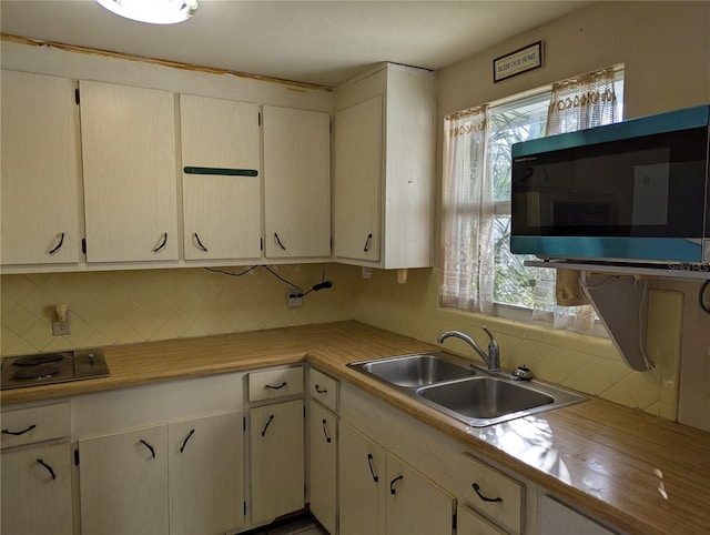 kitchen with decorative backsplash and sink