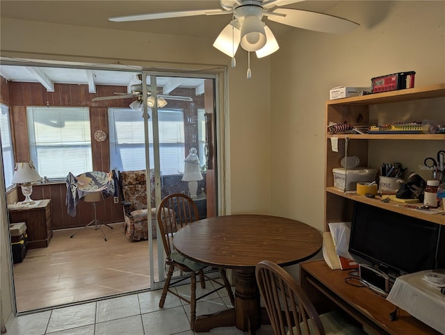 tiled dining space with beamed ceiling