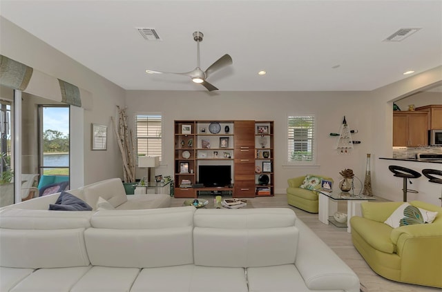 living room featuring ceiling fan