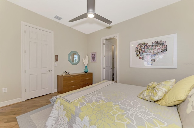 bedroom featuring ceiling fan and hardwood / wood-style flooring