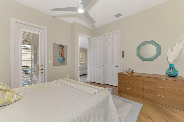 bedroom with ceiling fan and light wood-type flooring