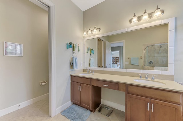 bathroom featuring tile patterned flooring, walk in shower, and vanity