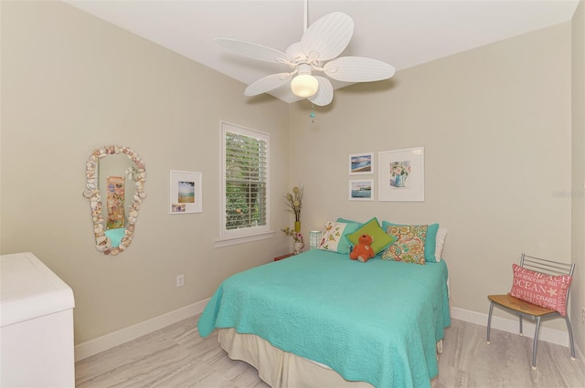 bedroom featuring ceiling fan and light hardwood / wood-style flooring