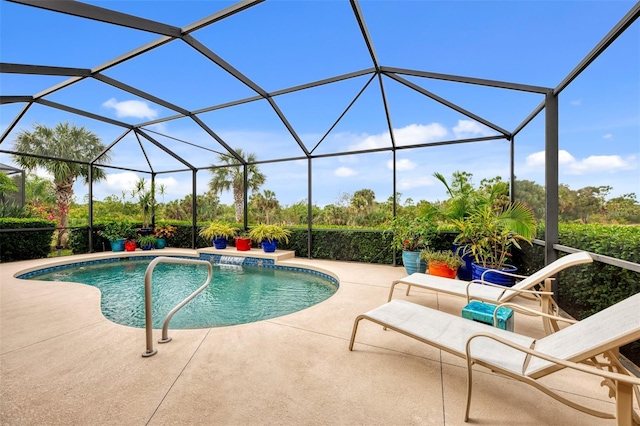 view of pool with a lanai and a patio