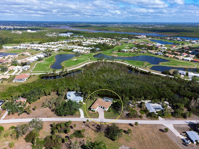 bird's eye view featuring golf course view and a water view