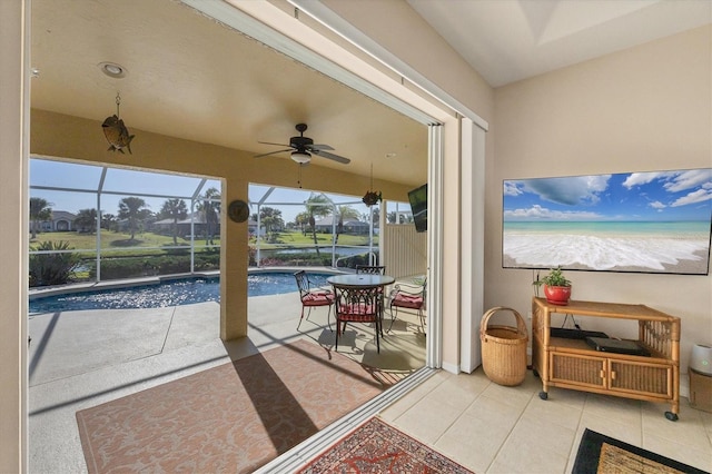 view of patio / terrace with ceiling fan and a lanai