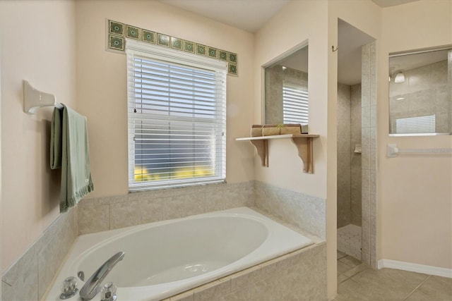 bathroom featuring separate shower and tub and tile patterned floors