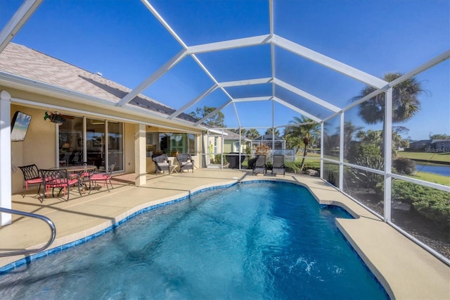 view of pool with a lanai and a patio