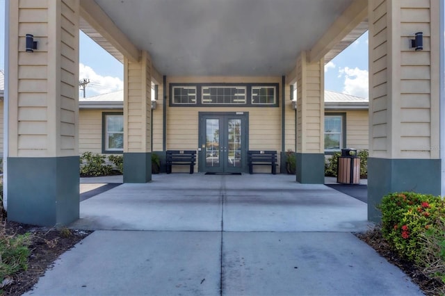 view of exterior entry featuring french doors