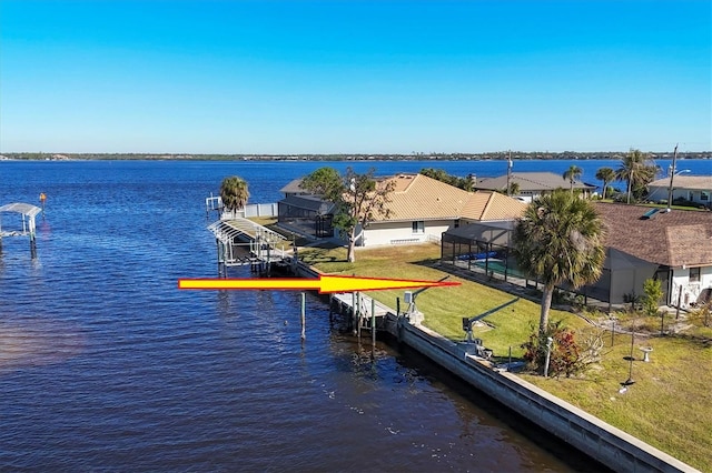 exterior space featuring a lanai and a water view