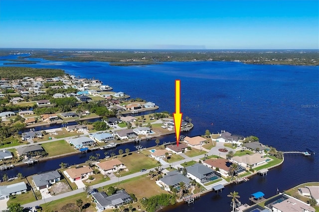 birds eye view of property featuring a water view