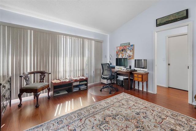 office space featuring hardwood / wood-style floors and lofted ceiling