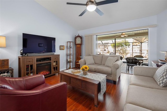 living room featuring hardwood / wood-style floors, ceiling fan, and vaulted ceiling