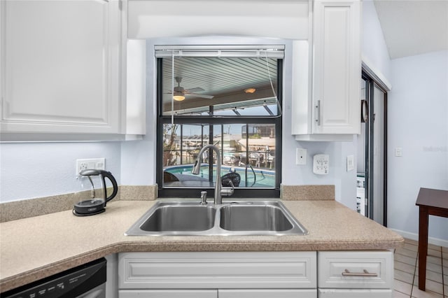 kitchen featuring white cabinets, dishwasher, ceiling fan, and sink